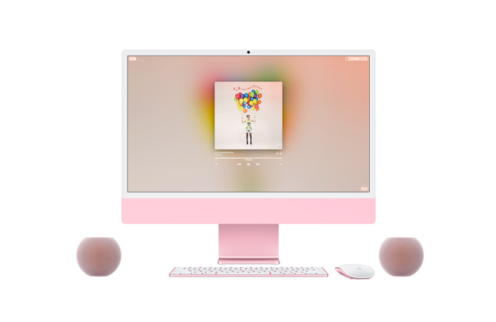 iMac rose, face avant, Apple Music à l’écran, Magic Keyboard et Magic Mouse de couleur assortie, accompagnés de deux haut-parleurs HomePod mini 2 roses en paire stéréo