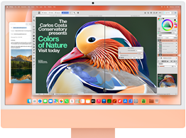 جهاز iMac، الجهة الخارجية الأمامية، لون برتقالي، يعرض تطبيقاً لتعديل الصور مع أدوات الذكاء الاصطناعي، وتطبيق البريد في الخلفية