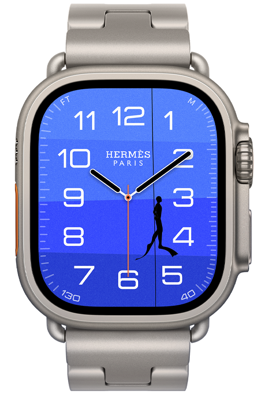 Apple Watch Hermès Ultra 4, Fathom and Wonder analog watch face (hour, minute, and second hands, Depth complication, with an orange buoy floating on top of a turquoise ocean with a gradient from light to dark blue), titanium case, natural color, right side exterior, Digital Crown, raised side button, paired with Grand H Titane band, Gris Titane color, background is an underwater scene with an orange buoy floating on top of a blue ocean that darkens towards the seafloor, with two light blue seahorses guarding an Hermès box on the seafloor