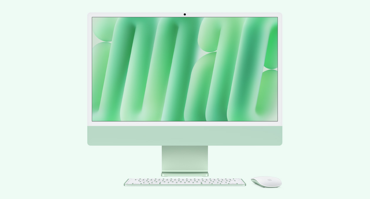 iMac i grøn vist forfra med Magic Mouse og Magic Keyboard i matchende farver