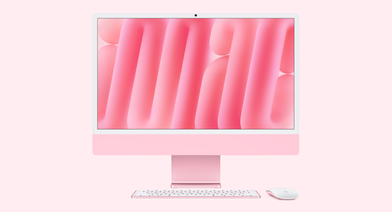 iMac i lyserød vist forfra med Magic Mouse og Magic Keyboard i matchende farver