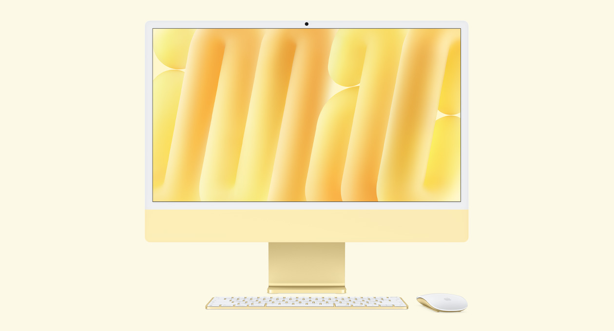 iMac i gul vist forfra med Magic Mouse og Magic Keyboard i matchende farver