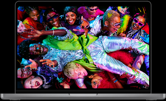 MacBook Pro, silver color, open, display shows image of person
